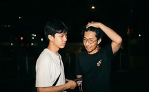 Flash portrait of two friends at night